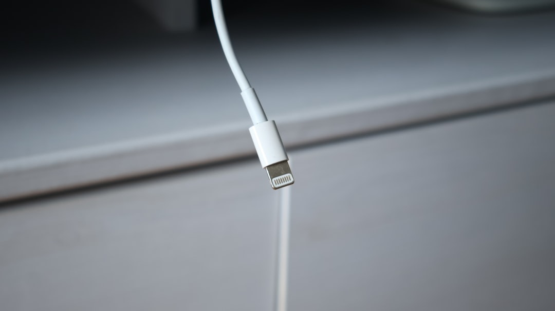 Fix iTunes Error 0xe800002d in Minutes – No More Annoying Popups! 1 a close up of a pair of headphones on a table iphone usb cable itunes error computer connection