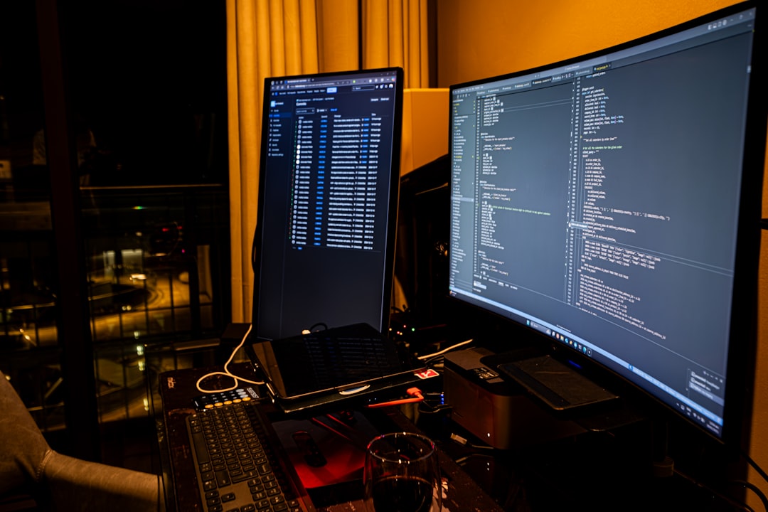 a man sitting in front of a computer monitor windows task manager high cpu usage system performance 1