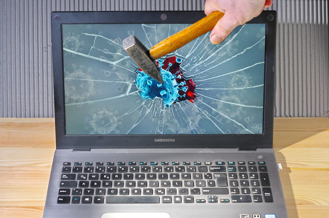 Can’t Install iTunes on Windows 10? The Ultimate Step-by-Step Fix 2 a person holding a pencil and a broken laptop antivirus settings firewall itunes connection
