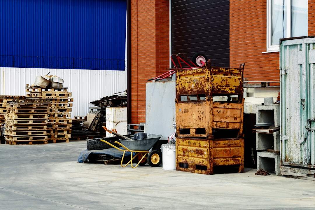 a pile of wooden crates sitting next to a building local supplier warehouse delivery regional dropshipping