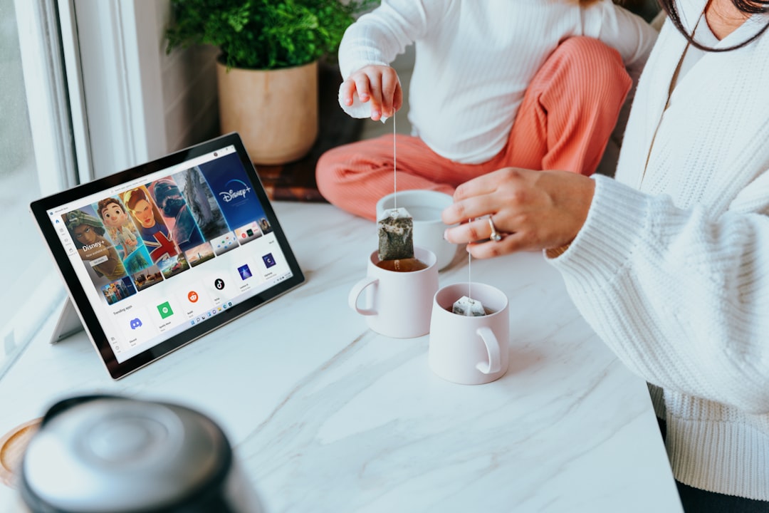 How much is a paid VPN? 1 a woman sitting at a table with two cups of coffee vpn pricing comparison technology subscription secure connection