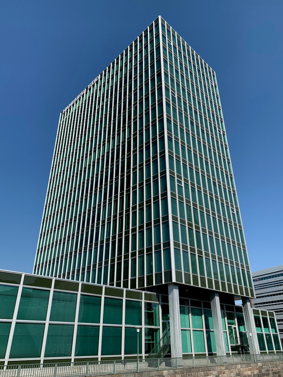 gray concrete building under blue sky during daytime microsoft building redmond campus office