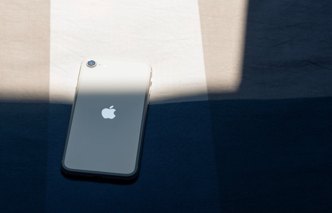 silver iphone 6 on white table macos finder iphone device sync