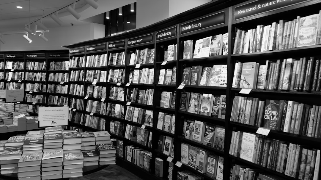 a black and white photo of a bookshelf full of books online bookstore rare books ecommerce reading