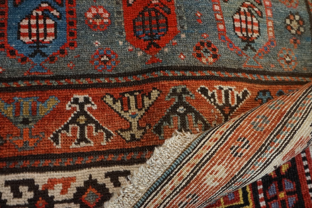 a close up of a colorful rug with many different colors faded berber rug sunlight damage vintage