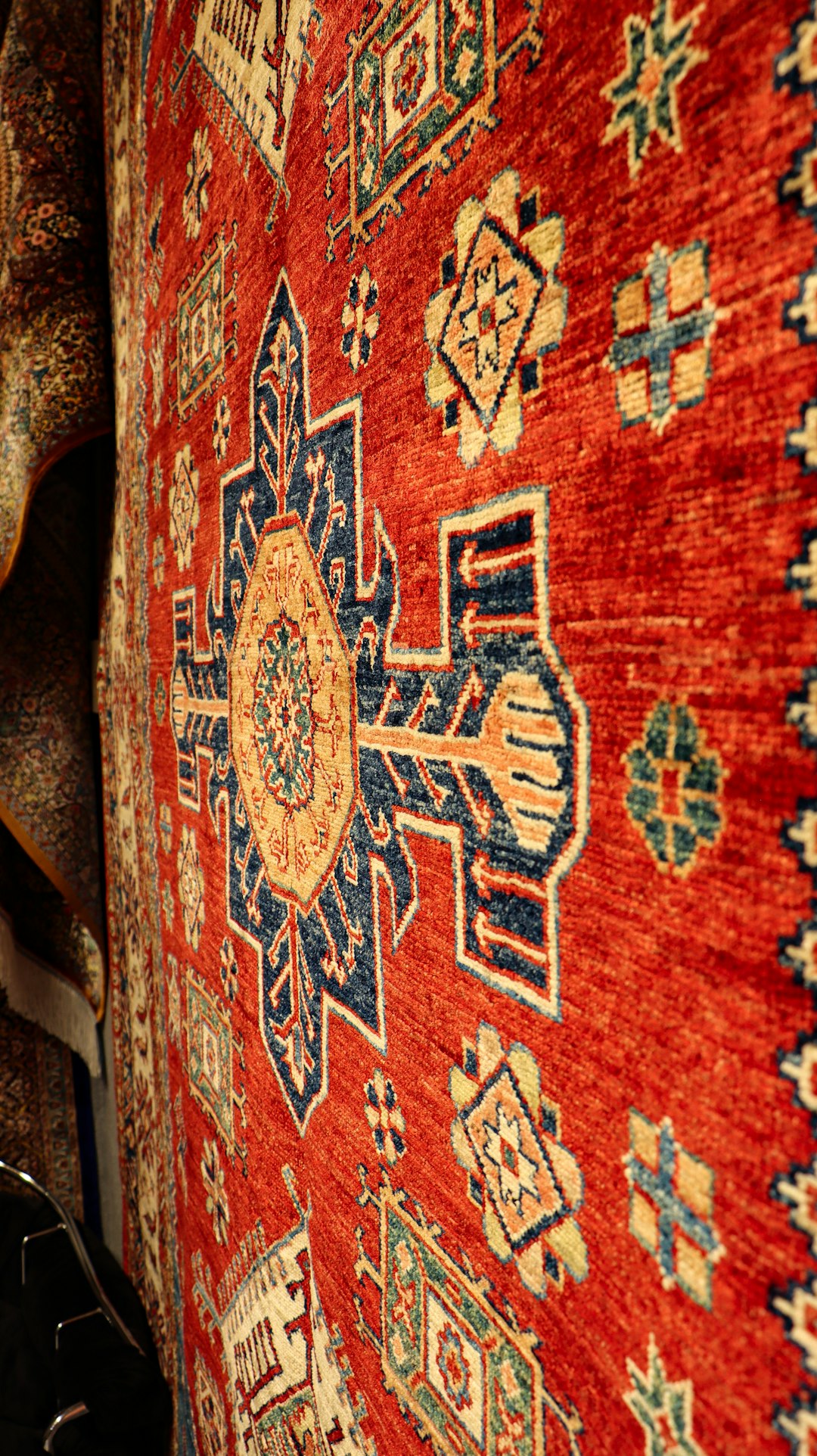 Berber Rug Browns: Understanding Undertones and Fading Over Time 3 a close up of a rug on a wall aged berber rug warm tones bohemian interior