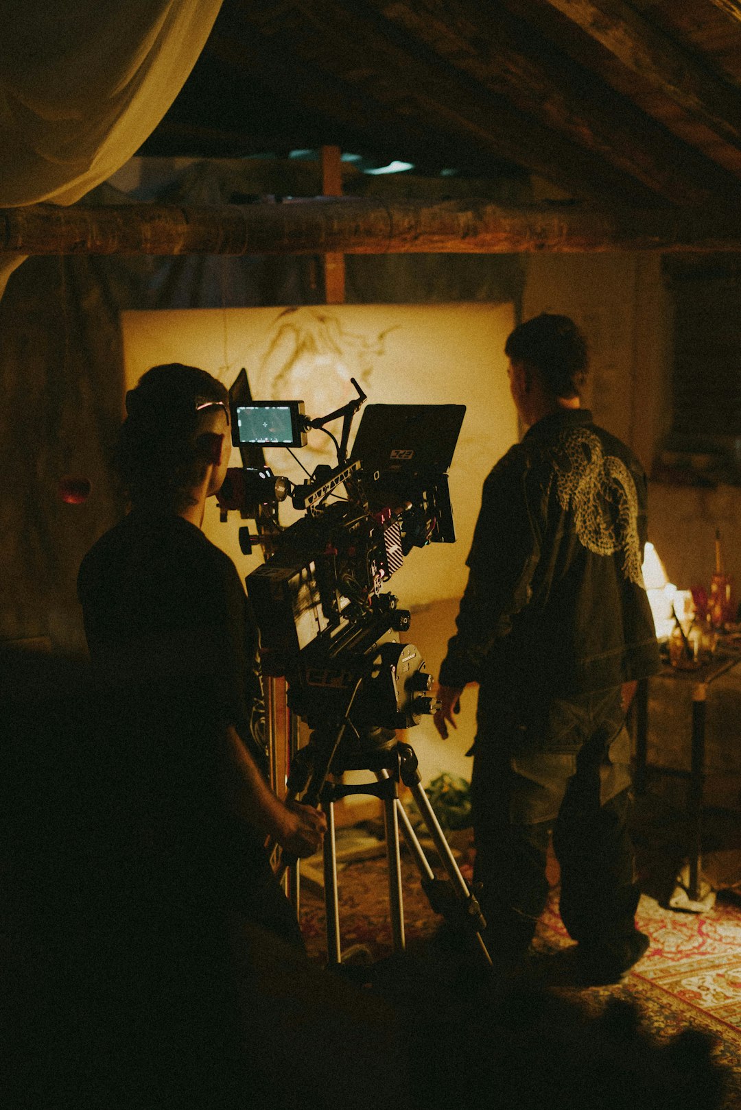 Choosing Between Photo and Ad Shoots: Objectives and Audience 2 a couple of people standing in front of a camera film crew advertising setup video shooting