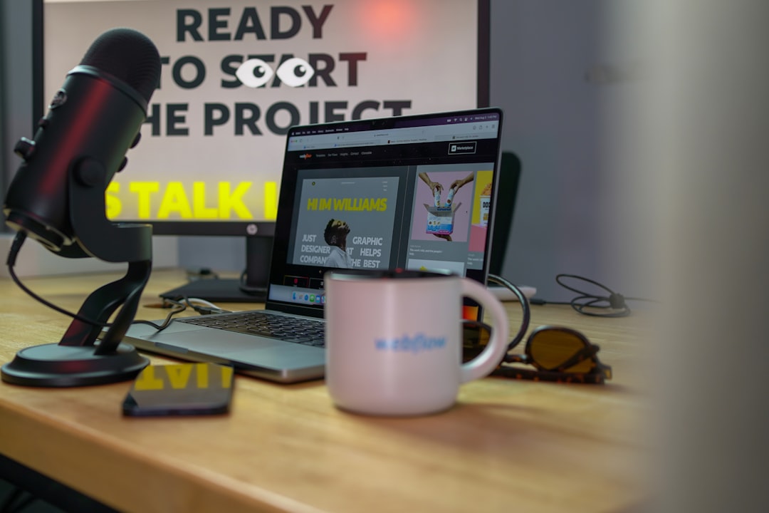 a laptop computer sitting on top of a wooden desk slack app remote team chat collaboration software 1