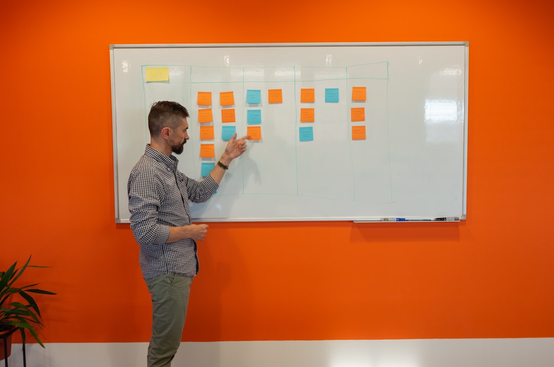 a man standing in front of a white board presentation mockup client pitch advertising concept