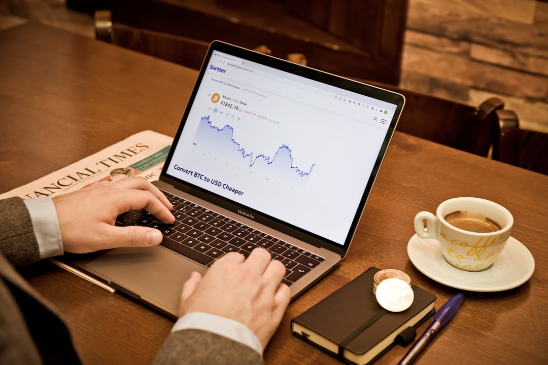 a person using a laptop on a wooden table sales funnel conversion rate optimization email marketing 1