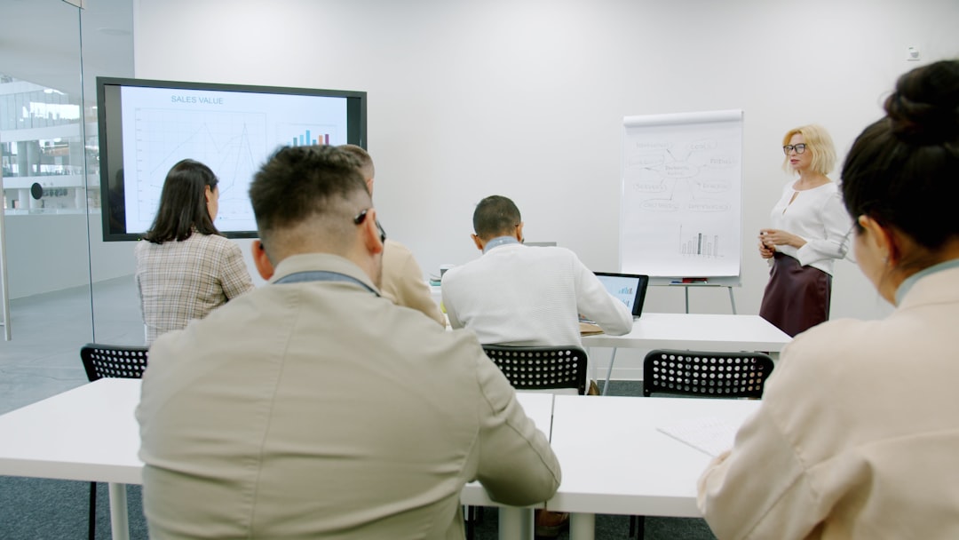 business people in a modern conference room during a presentation corporate security training business professionals learning cyber defense teamwork