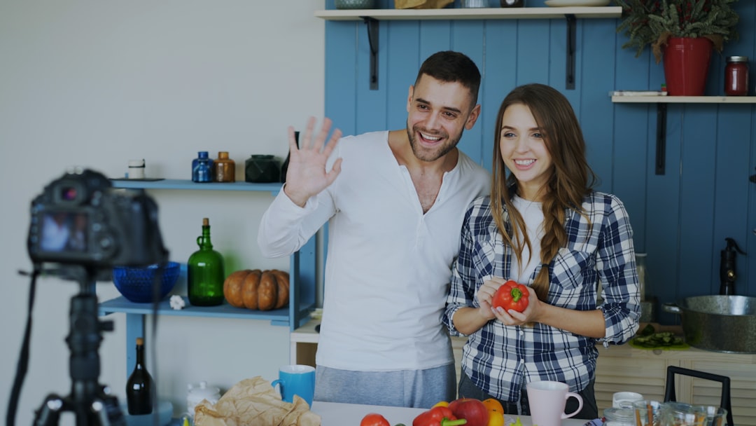 How to Monetize Your Food Blog: 10 Proven Strategies 2 couple filming a cooking tutorial in a kitchen food video cooking tutorial youtube recipe kitchen video
