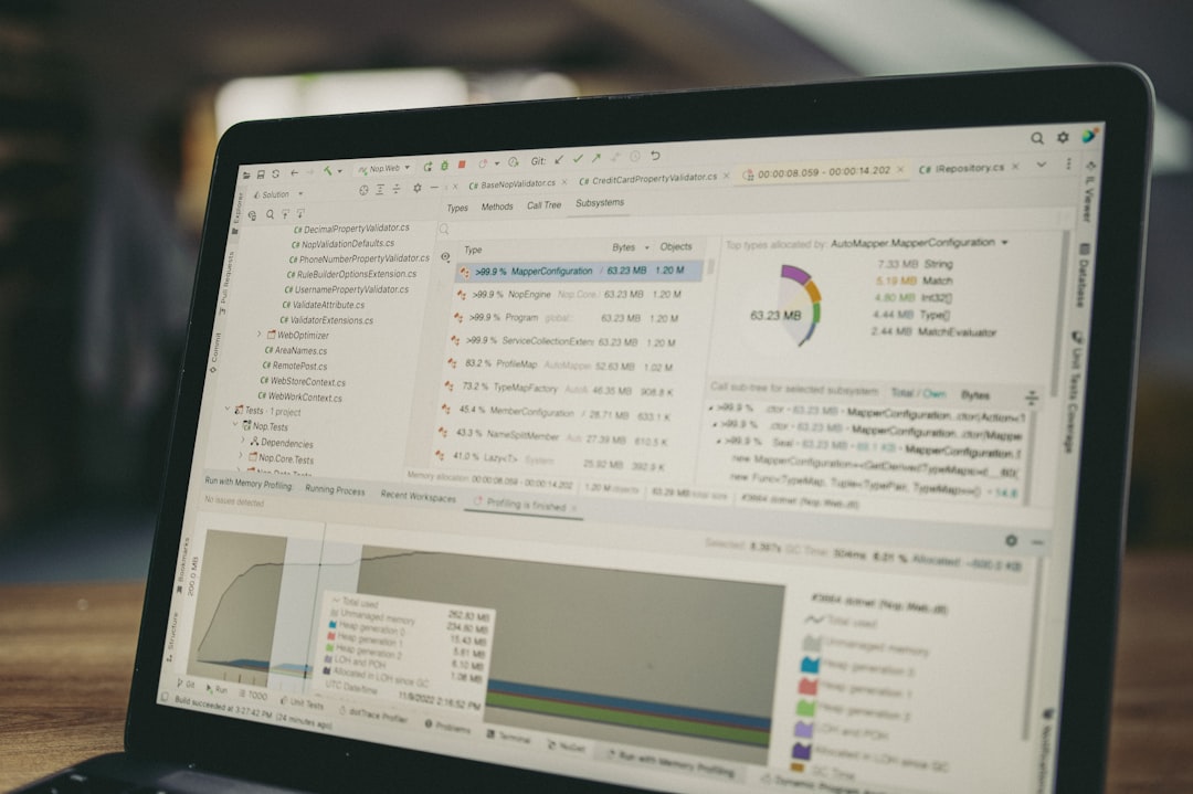 laptop screen displaying code and data charts windows search files directory structure text files list