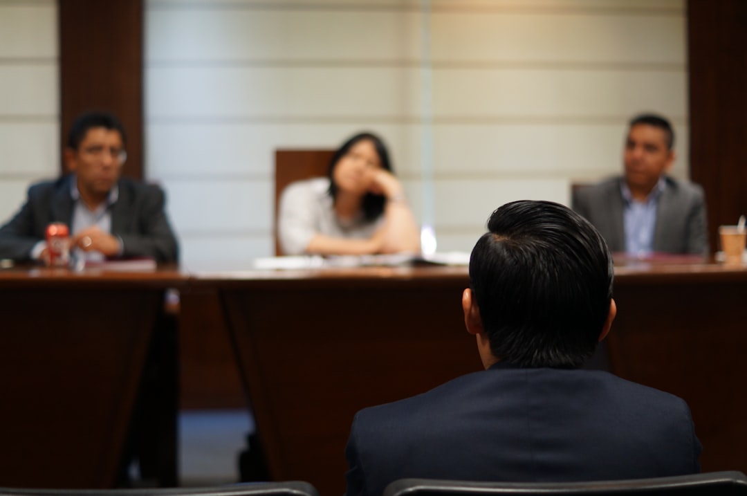 Wisconsin Business Entity Search: Dissolutions, Reinstatements & Mergers 2 man in black shirt sitting beside woman in white shirt business meeting business comeback document approval