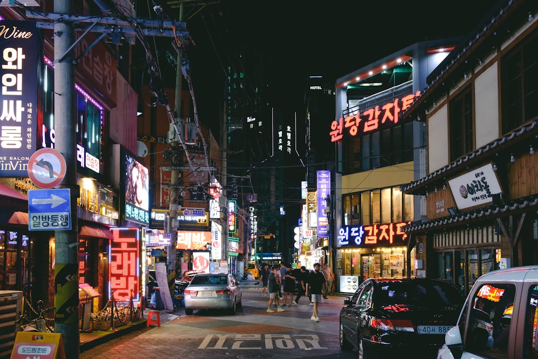 a busy city street at night with neon signs blog post update seo analytics content refresh 1