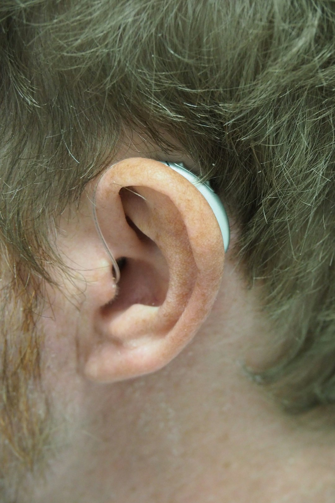 AirPods Pro 1 vs 2 visual differences 2 a close up of a person with a fake ear airpods pro earbuds sizes xs ear tips white ear tips