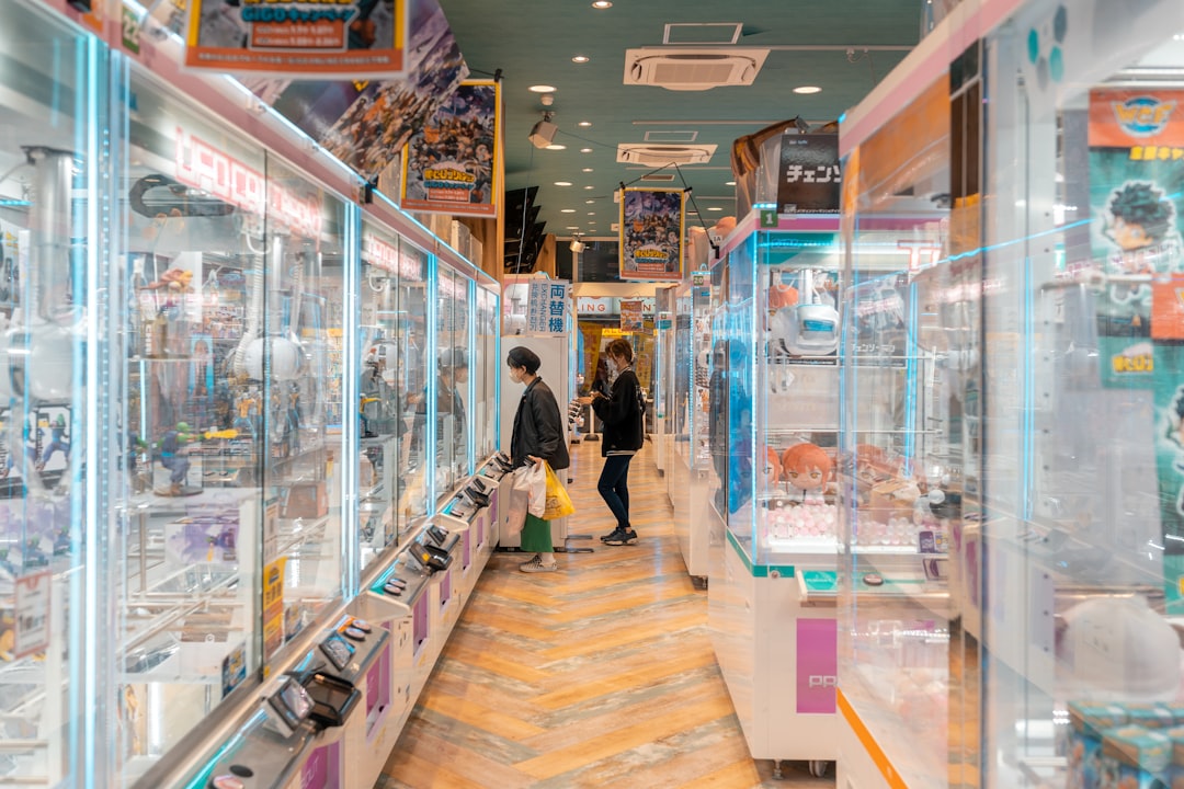Safer Holiday Electronics: Avoiding Counterfeit Adapters 2 a couple of people standing inside of a store electronic shopping adapters safe electronics