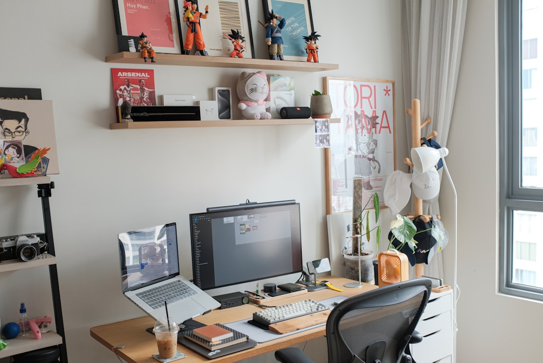 a desk with a computer and a chair in front of a window blog setup lifestyle blogger desk setup