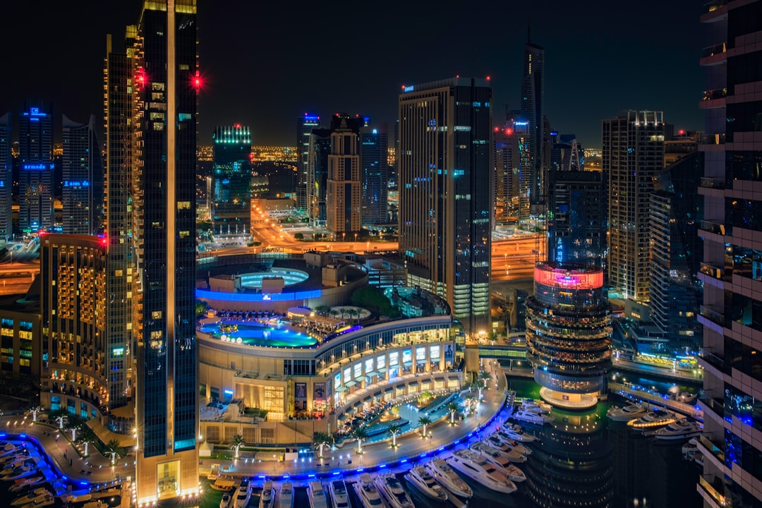 a night view of a city with a lot of tall buildings dubai tech hub blockchain ecosystem crypto startups
