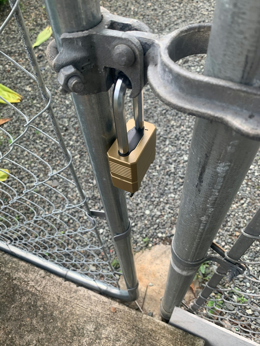 a padlock attached to a metal gate emergency access smart lock failure backup key