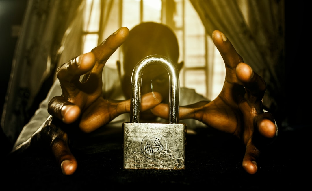 a person holding a padlock in front of a window crypto wallet security two factor authentication digital safety