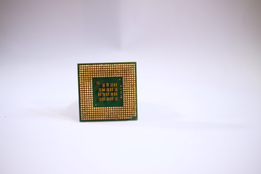 a small square object with a green and yellow design on it a17 pro gpu m2 chip comparison 3d benchmark