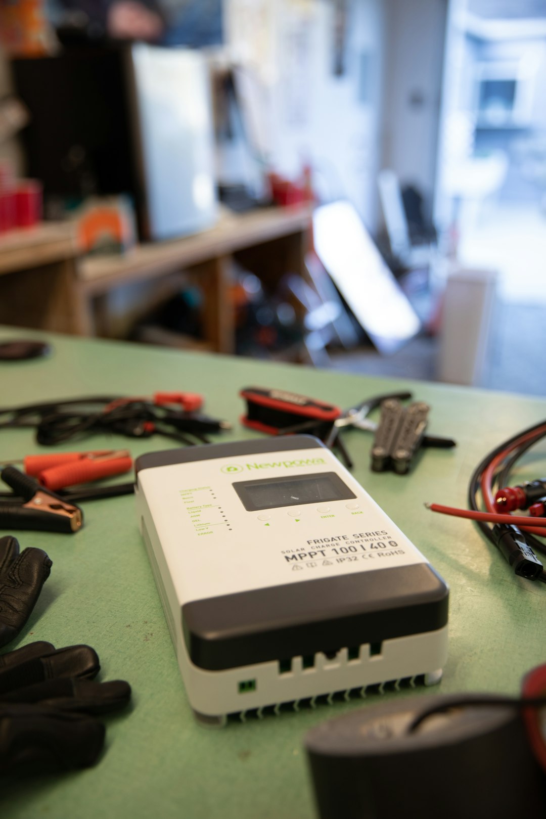 Safer Holiday Electronics: Avoiding Counterfeit Adapters 1 a table with a lot of tools on it counterfeit chargers fake electronics fire hazard