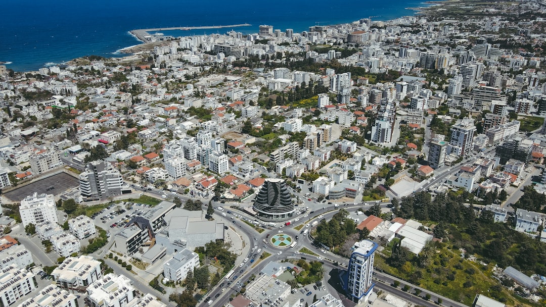 an aerial view of a city with a large body of water in the background cyprus cysec building government authority crypto licensing process