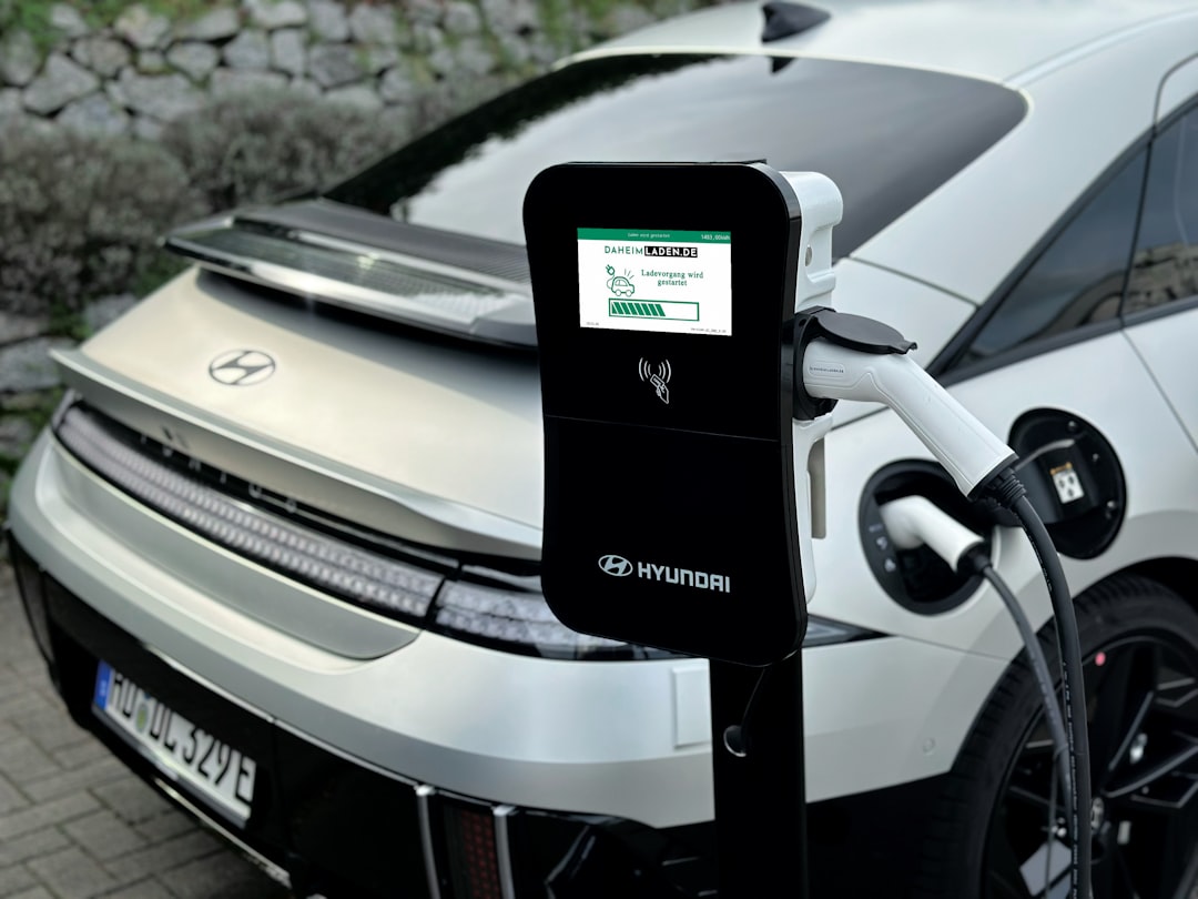 an electric car plugged in to a charging station ev future smart charging user interface