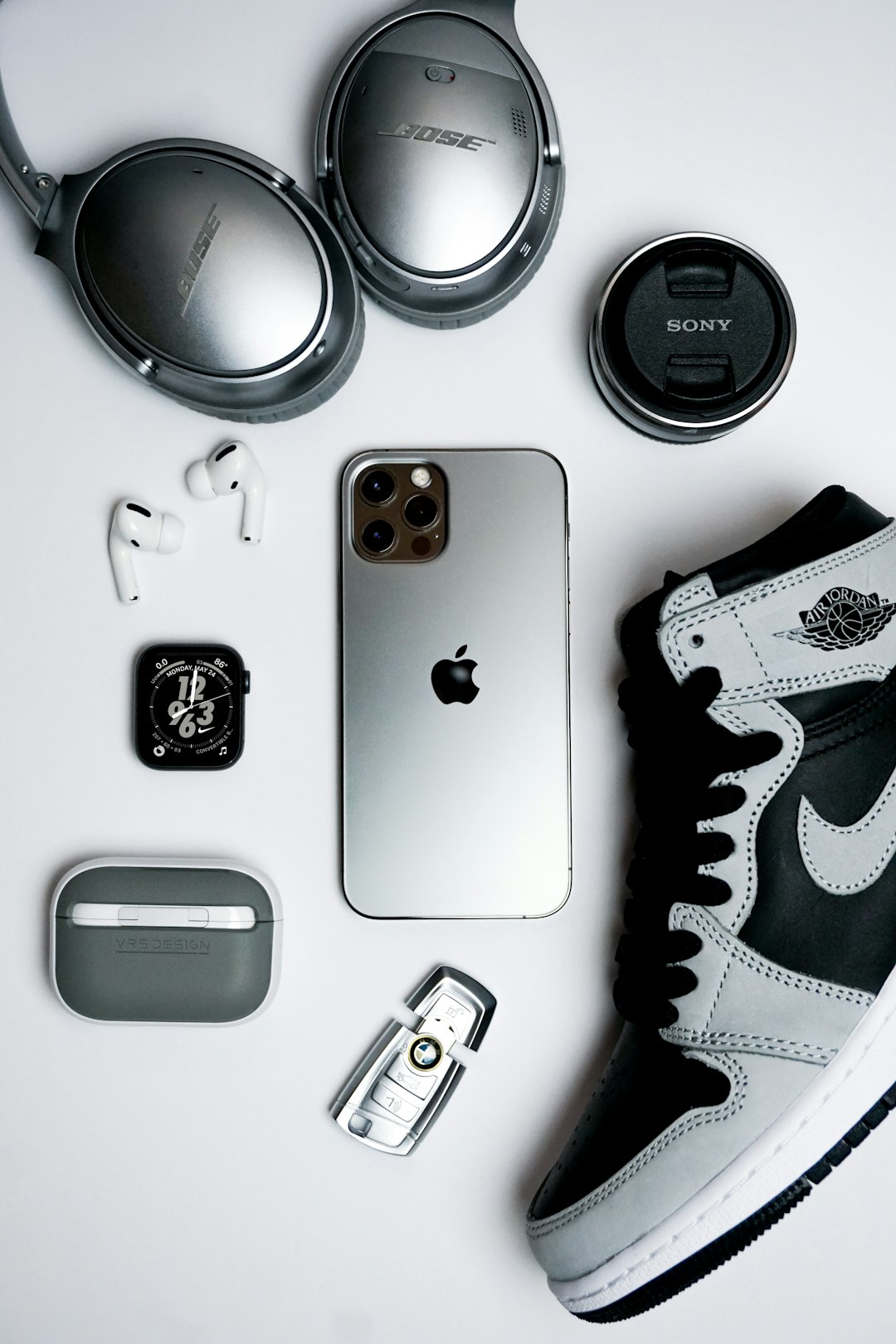 black iphone 4 beside silver and black camera iphone accessories moment lens lightning cable