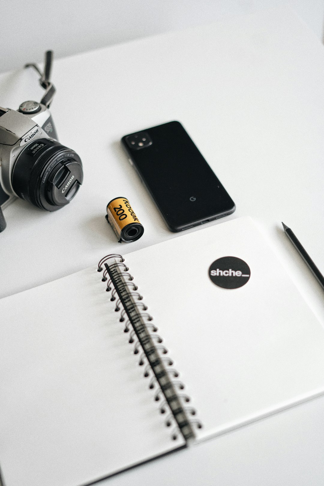 black iphone 7 beside silver and gold watch and silver macbook lifestyle blogger social media strategy content planning