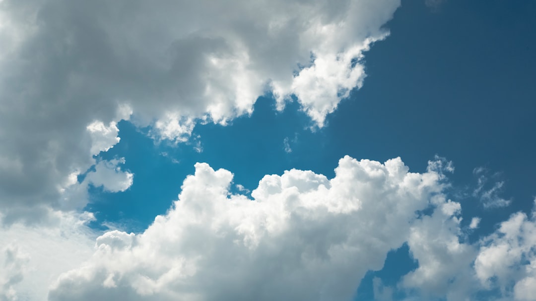 clouds fill the sky with a bright blue space cloud integration digital communication future technology