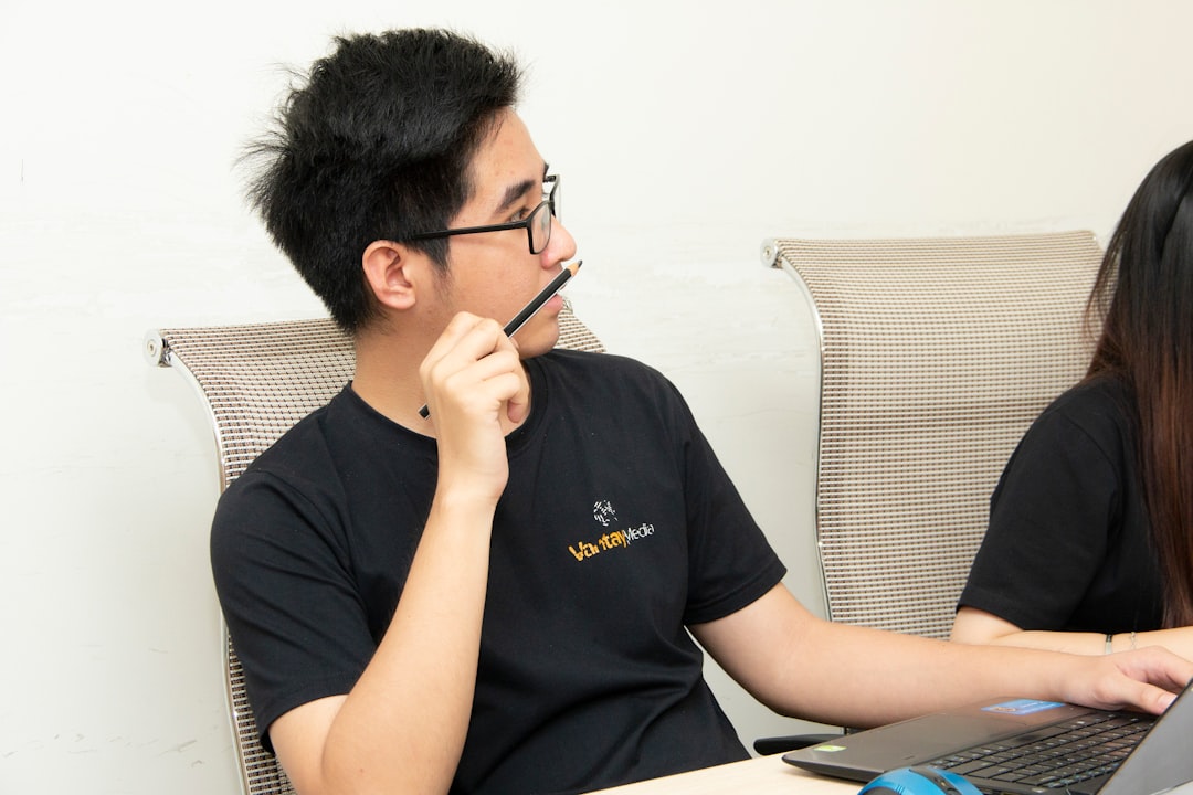 How to Optimize Your Blog Posts for SEO: Advanced Tips for Maximum Traffic Growth 2 mens black crew neck shirt holding black pencil close up photography blog post update seo analytics content refresh