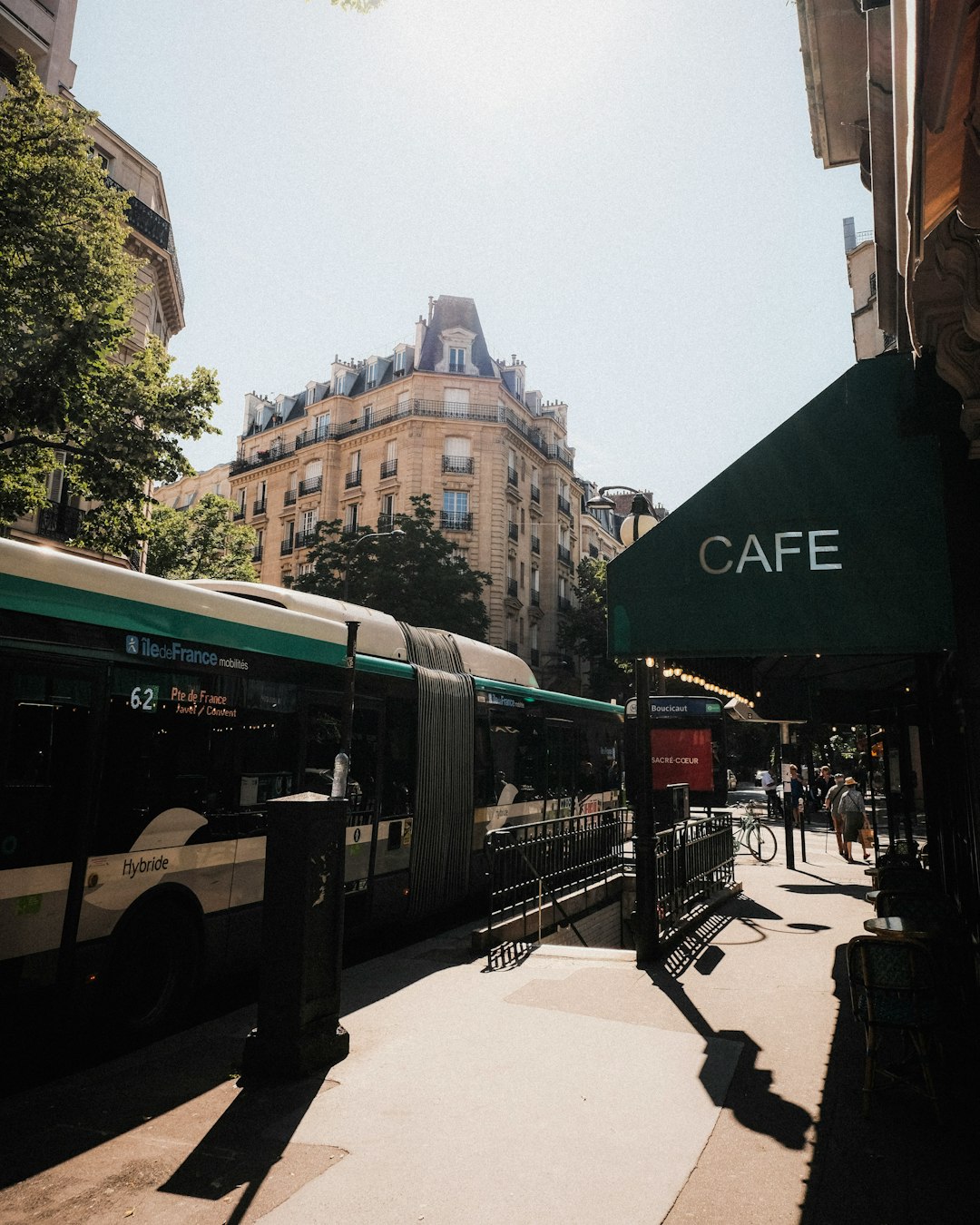a bus parked on the side of a street paris travel charging devices coffee laptop 2