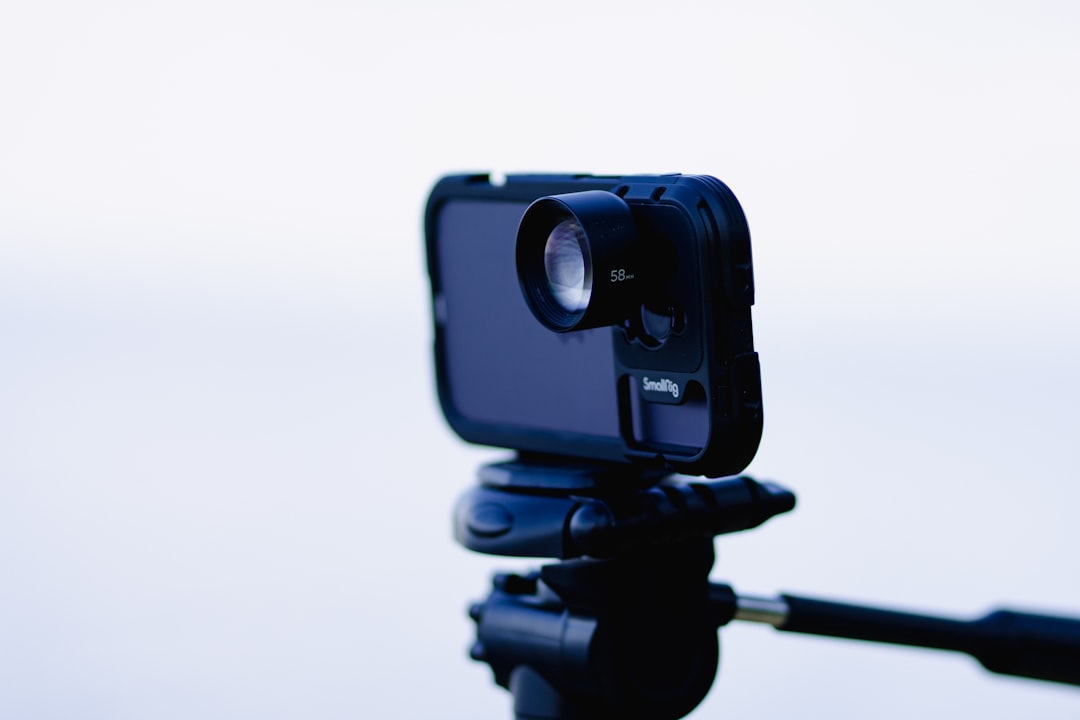 a close up of a camera on a tripod video conference camera settings professional appearance