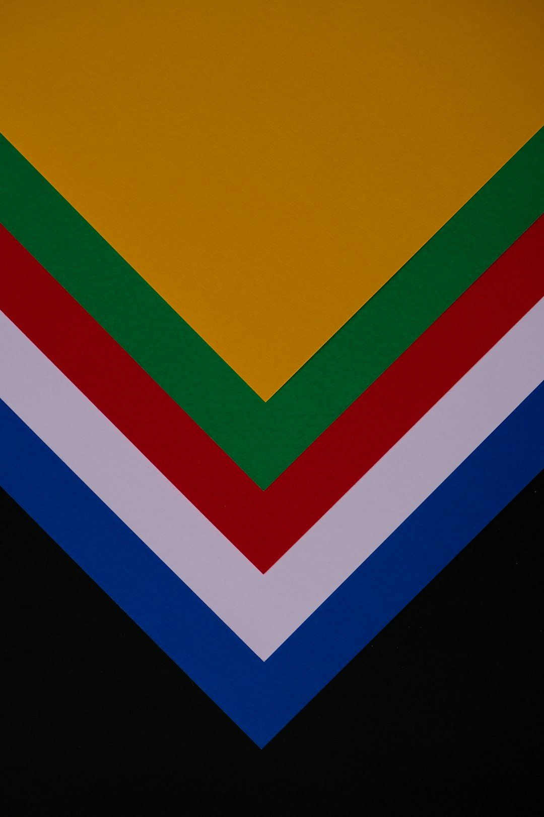 a close up of a stack of different colored papers australia branding nature colors inclusive logo
