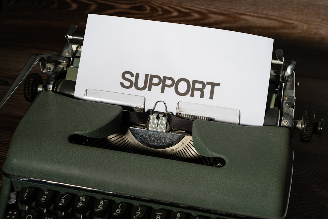 a close up of a typewriter with a paper on it customer support user documentation online help