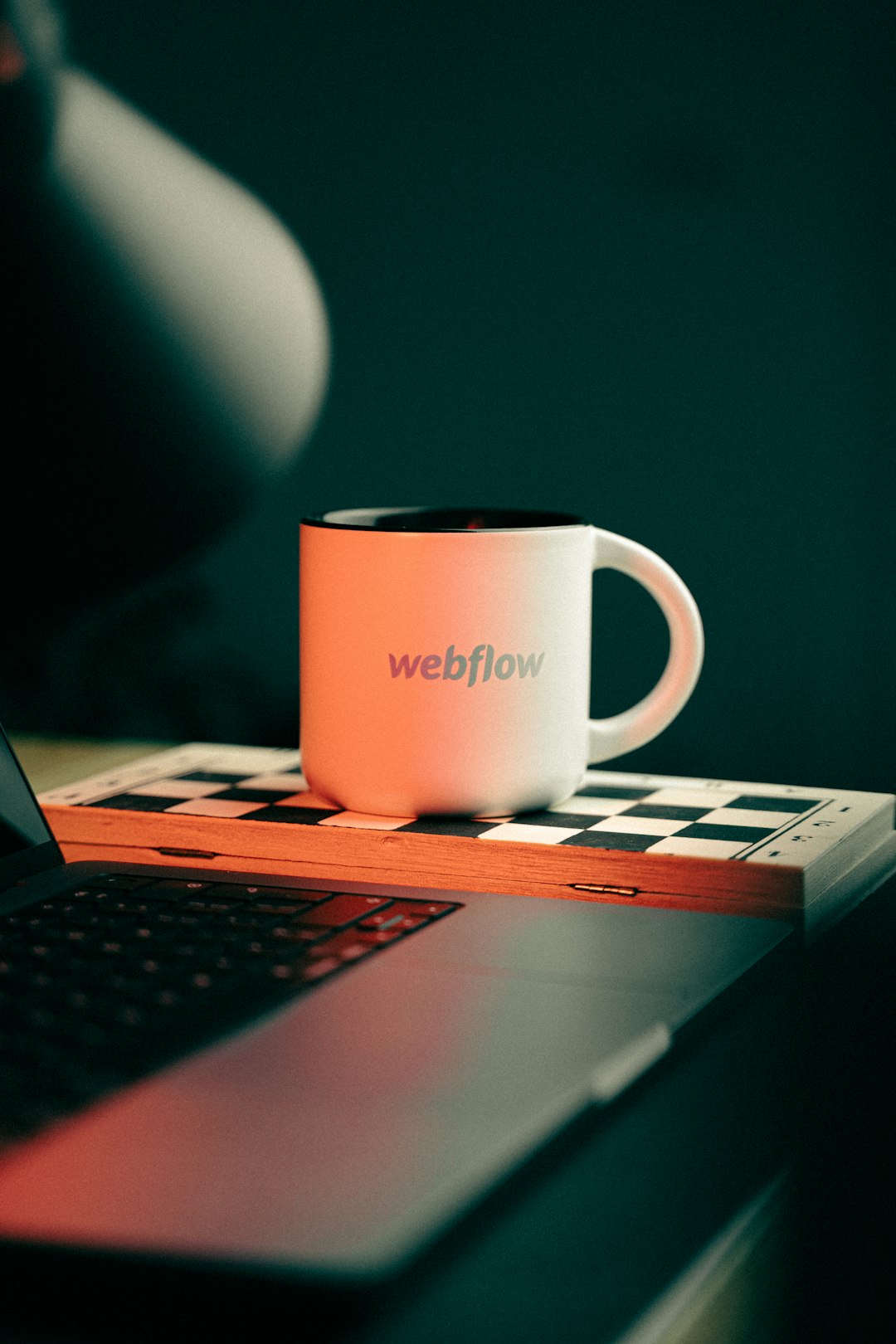 a coffee mug sitting on top of a laptop computer wordpress backup website migration push to live developer tools