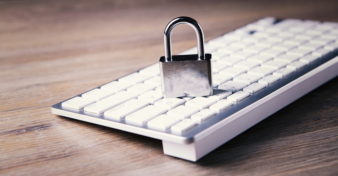 a computer keyboard with a padlock on top of it cybersecurity payment online money safety