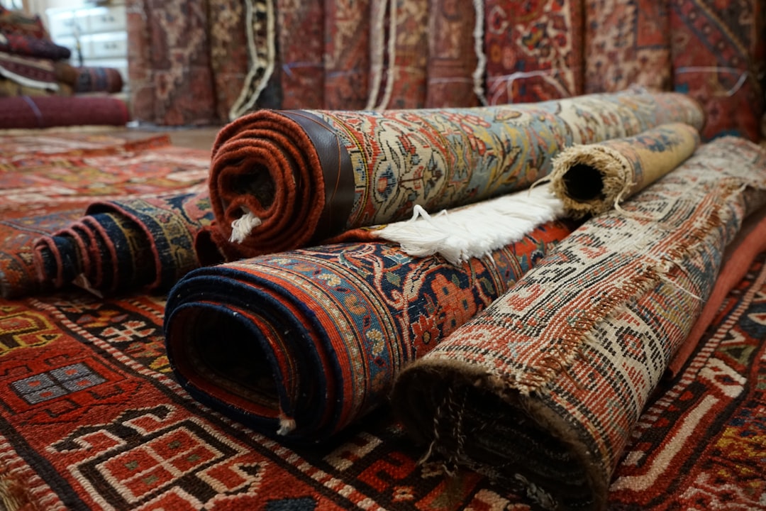 a pile of rugs laying on top of each other faded berber rug sunlight damage vintage