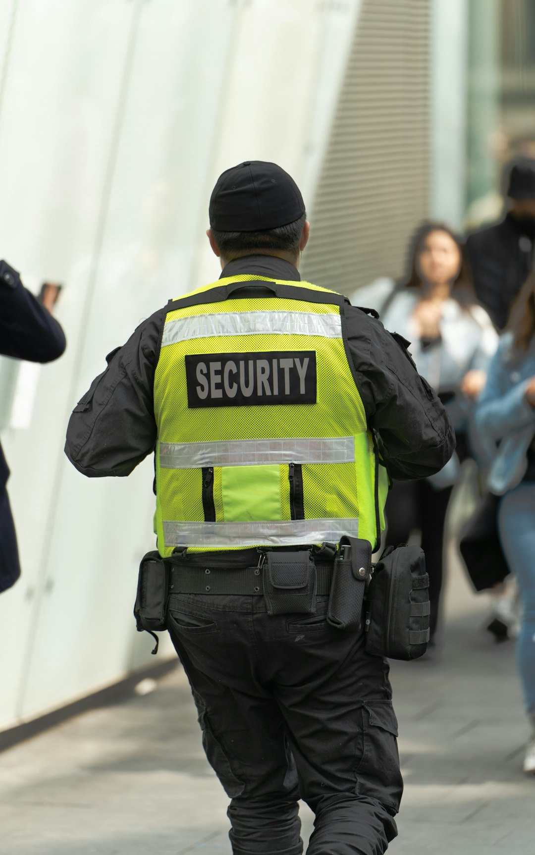 a security officer walking down a street corporate security training business professionals learning cyber defense teamwork 1