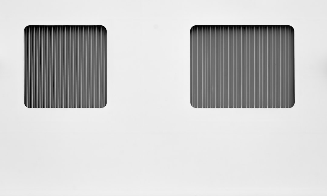 a white wall with two square windows on it ereader comparison epub vs azw3 file formats