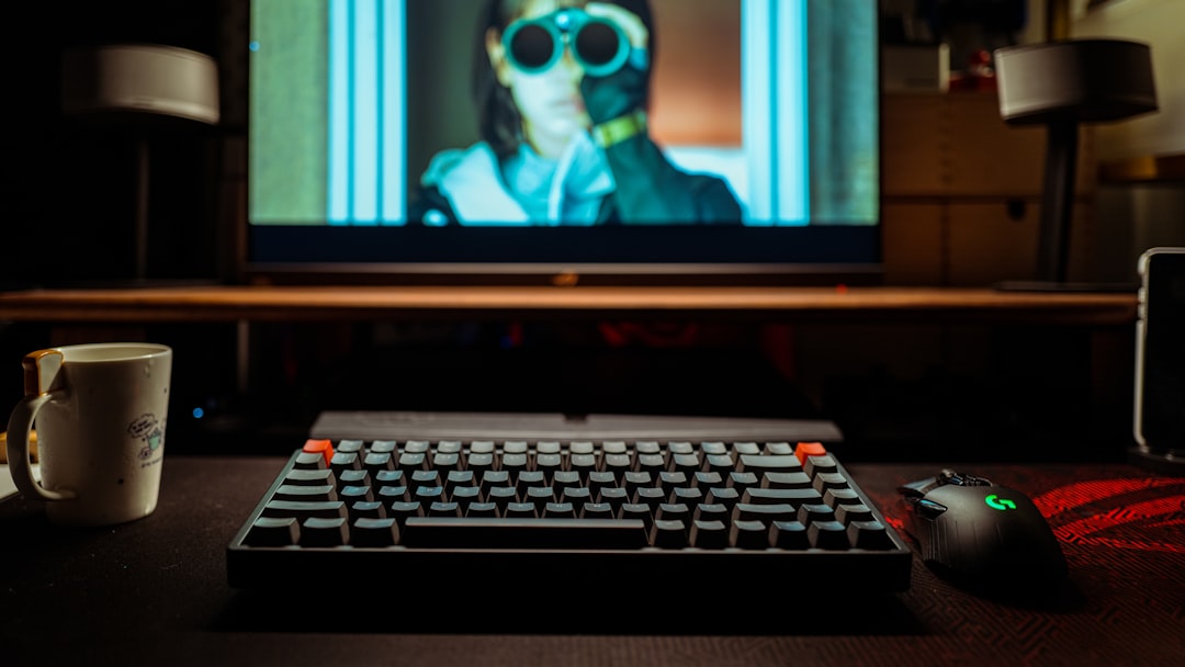 black flat screen computer monitor turned on displaying man in black sunglasses horror movie script artificial intelligence digital screenwriting