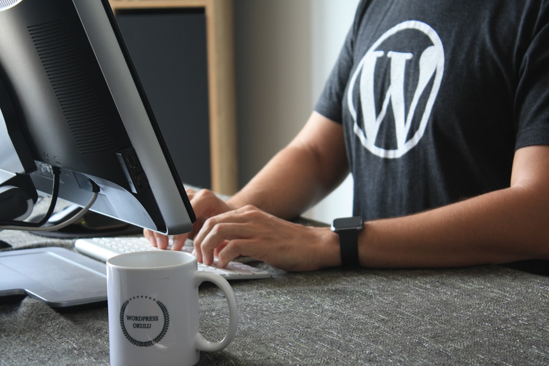 person in black and white t shirt using computer wordpress backup website migration push to live developer tools