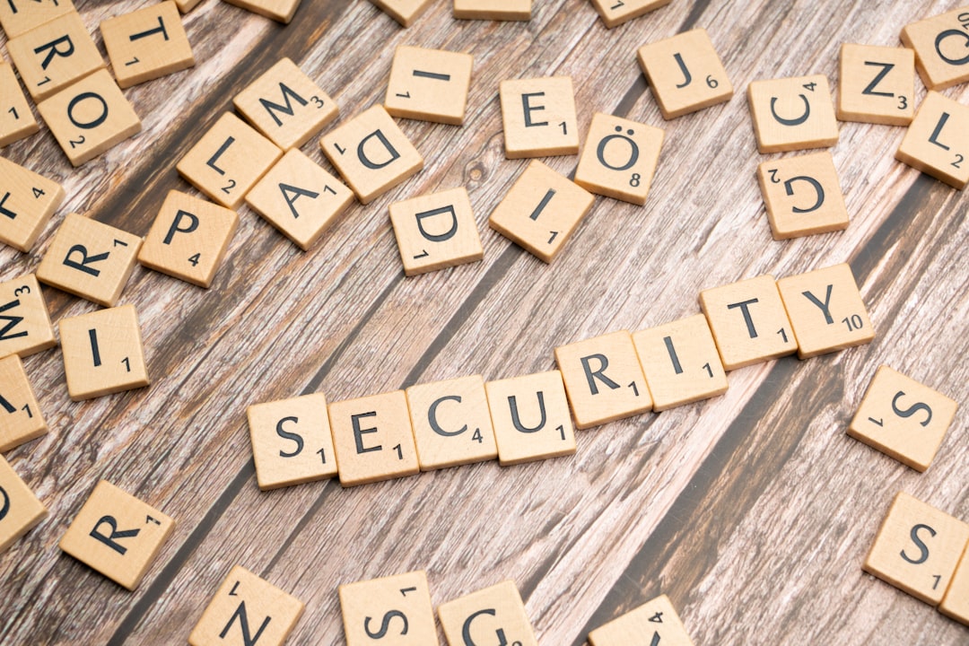 scrabble tiles spelling security on a wooden surface security settings server files code protection