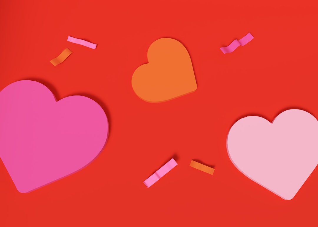 three paper hearts on a red background with confetti lgbtq party hookup dating app