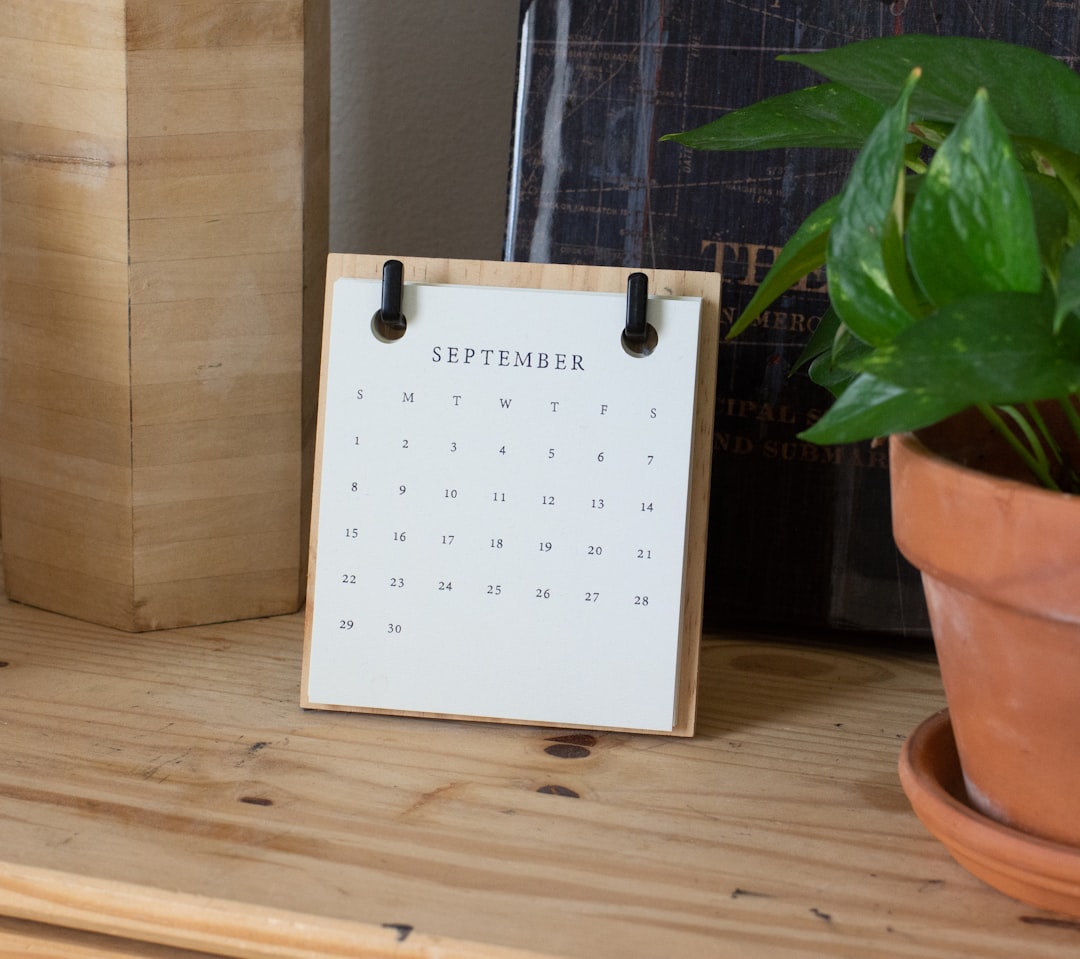 white braille paper on brown wooden table ical sync airbnb calendar booking system
