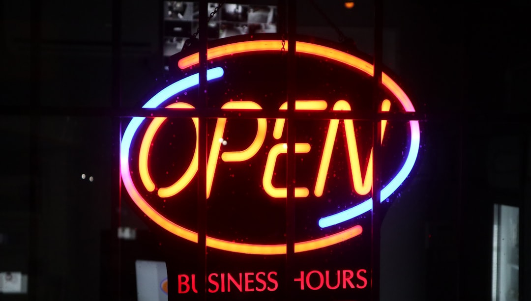 a lighted sign with a word on it small business office customer service website integration