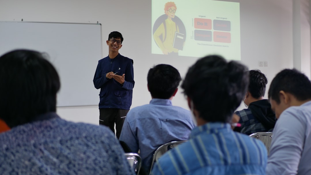 a man standing in front of a group of people keynote presentation voiceover navigation teacher classroom