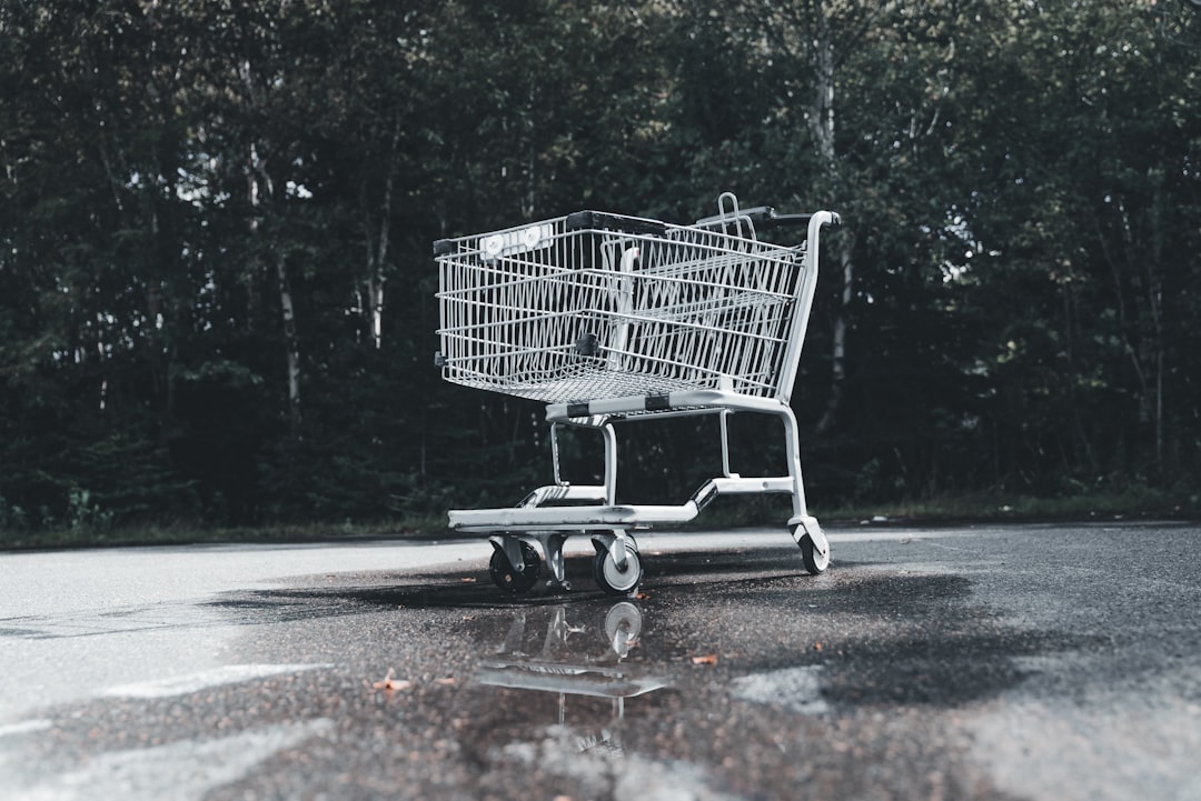 a shopping cart sitting in the middle of a parking lot angry customer screen shopping cart error